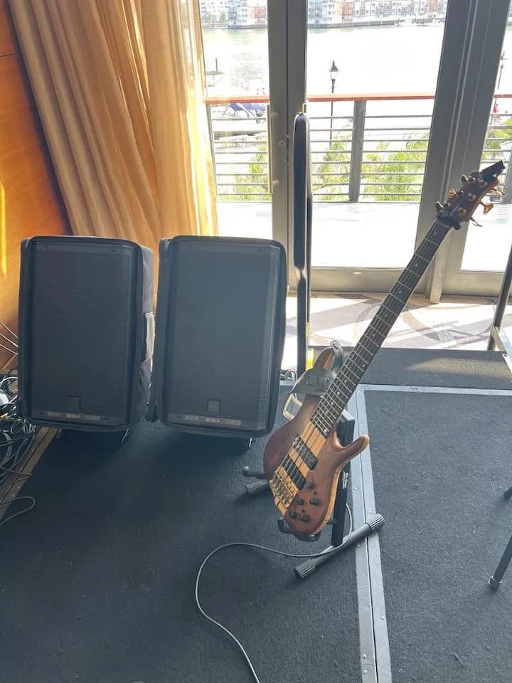 Russ set up with two RCF speakers at a car dealership gig